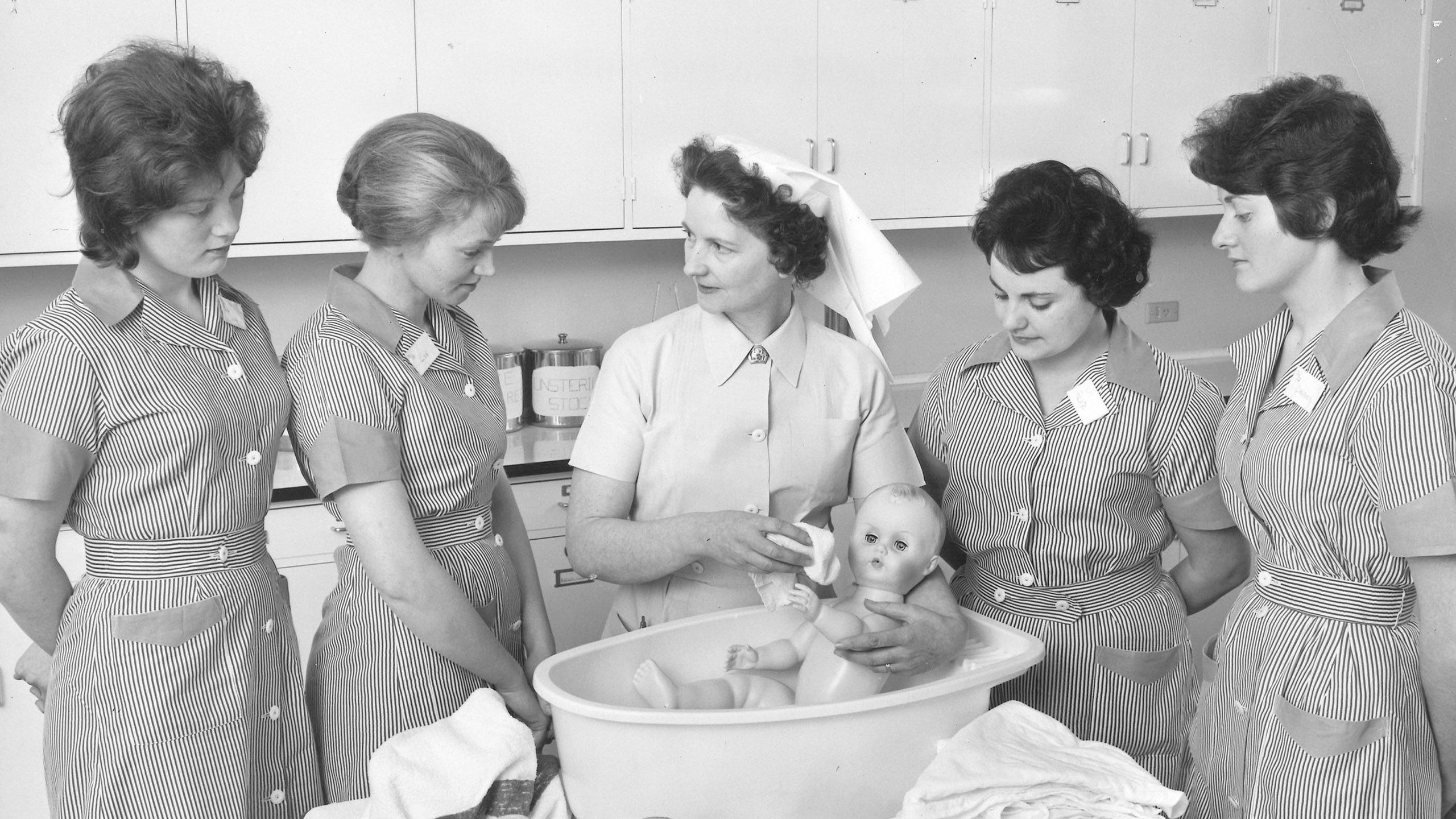 Students learning about bathing the baby. Photo: Nursing Aide School annual report 1962-63