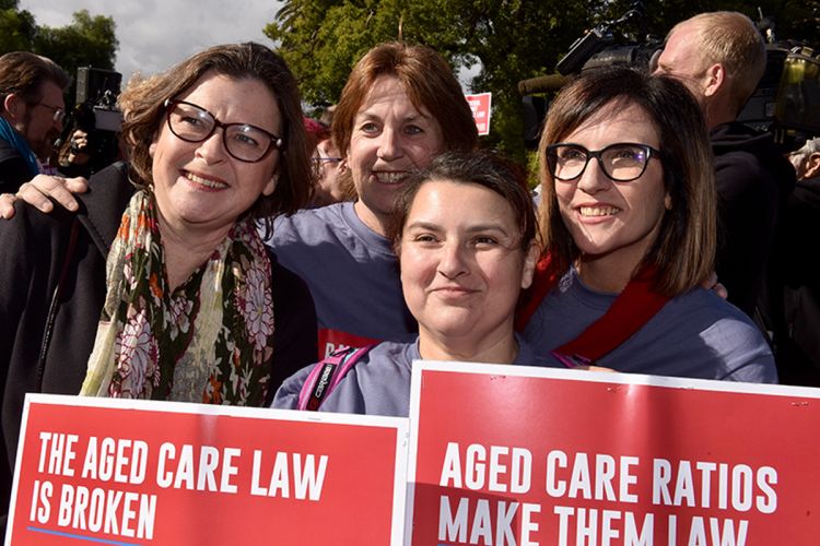Labor Member for Batman and former ACTU Secretary Ged Kearney, ANMF (Vic Branch) Secretary Lisa Fitzpatrick and ANMF Federal Secretary Annie Butler pose for a photo with an ANMF member at the Victorian launch of the ratios in private aged care campaign.