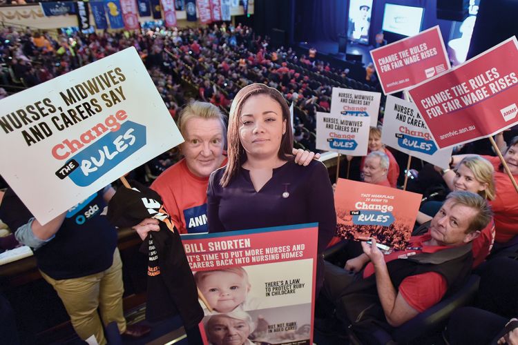 Nurses and midwives gather with thousands of other unionists at the 'Change the rules' meeting at Melbourne Town Hall in April 2018